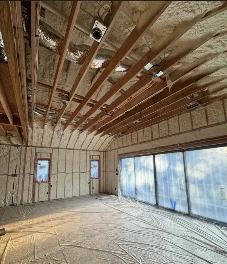 Interior walls and ceiling insulated with spray foam during new construction in Spring
